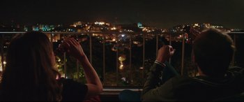 Movie still from “Everybody Loves Jeanne” (2022), directed by Céline Devaux – Two people sitting in front of a window at night; Medium shot, Over the shoulder angle