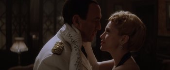 Movie still from “Evita” (1996), directed by Alan Parker – A man and a woman are looking at each other; Close Up shot, Low angle