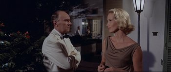 Movie still from “Exodus” (1960), directed by Otto Preminger – A man and a woman are talking to each other; Medium shot, Low angle