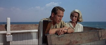Movie still from “Exodus” (1960), directed by Otto Preminger – A man and a woman sitting next to each other on a bench; Close Up shot, Low angle