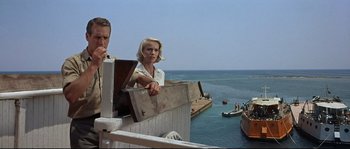 Movie still from “Exodus” (1960), directed by Otto Preminger – A man and a woman standing on a balcony; Wide shot, Low angle