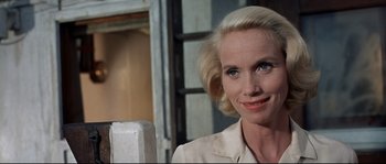 Movie still from “Exodus” (1960), directed by Otto Preminger – A woman with blonde hair is smiling for the camera; Close Up shot, Low angle