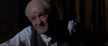 Movie still from “Exodus” (1960), directed by Otto Preminger – An old man with a white beard is looking at the camera; Close Up shot, Low angle