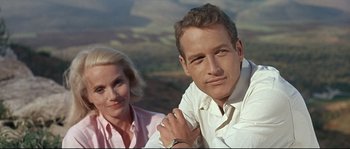 Movie still from “Exodus” (1960), directed by Otto Preminger – A man and a woman posing for a picture; Close Up shot, Low angle