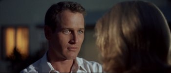 Movie still from “Exodus” (1960), directed by Otto Preminger – A person wearing a white shirt; Close Up shot, Over the shoulder angle