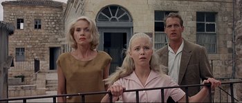 Movie still from “Exodus” (1960), directed by Otto Preminger – A group of people standing next to each other near a building; Medium shot, Low angle