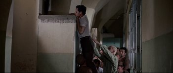 Movie still from “Exodus” (1960), directed by Otto Preminger – A group of people standing on top of a wall; Wide shot, Low angle