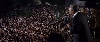 Movie still from “Exodus” (1960), directed by Otto Preminger – A large crowd of people gathered in the street; Extreme Wide shot, High angle