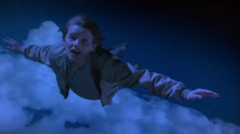 Movie still from “Explorers” (1985), directed by Joe Dante – A young girl flying through the air at night; Medium shot, Overhead angle