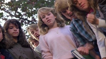 Movie still from “Explorers” (1985), directed by Joe Dante – A group of young people standing next to each other; Close Up shot, Low angle
