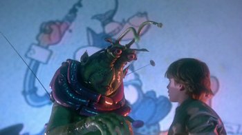 Movie still from “Explorers” (1985), directed by Joe Dante – A boy is looking at a statue of a creature; Close Up shot, Low angle