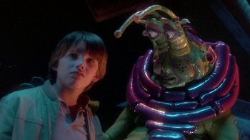 Movie still from “Explorers” (1985), directed by Joe Dante – A young boy and a balloon creature in a dark room; Close Up shot, Low angle