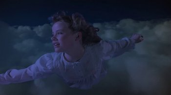 Movie still from “Explorers” (1985), directed by Joe Dante – A young girl flying through the air at night; Medium shot, High angle