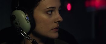 Movie still from “Eye in the Sky” (2015), directed by Gavin Hood – A woman's face in a dark room; Close Up shot, Low angle