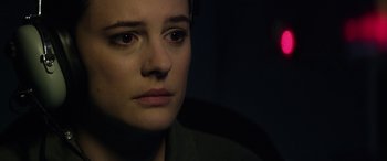Movie still from “Eye in the Sky” (2015), directed by Gavin Hood – A woman's face in the dark; Close Up shot, Over the shoulder angle