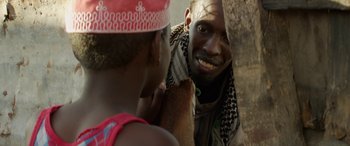 Movie still from “Eye in the Sky” (2015), directed by Gavin Hood – A man and a woman are talking to each other; Close Up shot, Over the shoulder angle