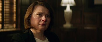 Movie still from “Eye in the Sky” (2015), directed by Gavin Hood – A person looking at the camera; Close Up shot, Over the shoulder angle