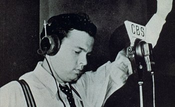 Movie still from “F for Fake” (1973), directed by François Reichenbach – An old photo of a man with headphones on; Close Up shot, Low angle