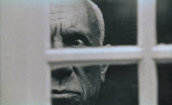 Movie still from “F for Fake” (1973), directed by François Reichenbach – An old man looking through a window with his eyes wide open; Extreme Close Up shot, Low angle
