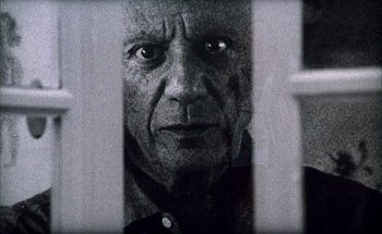 Movie still from “F for Fake” (1973), directed by François Reichenbach – An old man looking through a window at the camera; Extreme Close Up shot, Low angle