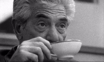 Movie still from “Faces” (1968), directed by John Cassavetes – An older man is eating something from a white bowl; Close Up shot, High angle