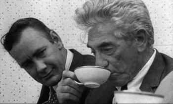 Movie still from “Faces” (1968), directed by John Cassavetes – A man and a woman are drinking coffee; Close Up shot, Over the shoulder angle