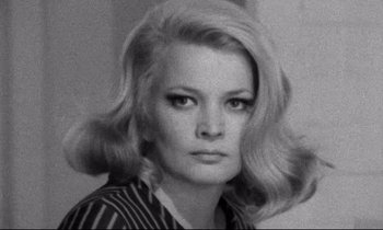 Movie still from “Faces” (1968), directed by John Cassavetes – A black - and - white photo of a woman with blonde hair; Close Up shot, Low angle