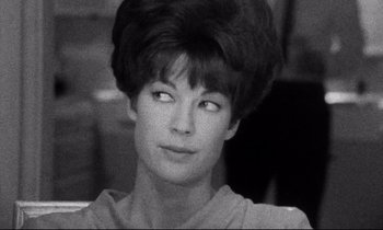 Movie still from “Faces” (1968), directed by John Cassavetes – A black and white photo of a woman with short hair; Close Up shot, Low angle
