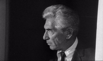 Movie still from “Faces” (1968), directed by John Cassavetes – An older man wearing a suit and a tie; Close Up shot, Low angle
