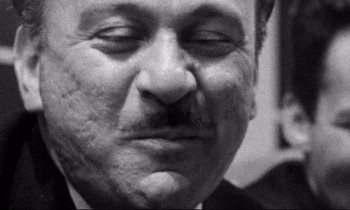 Movie still from “Faces” (1968), directed by John Cassavetes – An older man with a mustache and a goatee; Close Up shot, Low angle