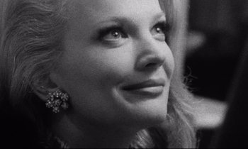 Movie still from “Faces” (1968), directed by John Cassavetes – Black and white photograph of a woman looking to her left; Close Up shot, Over the shoulder angle
