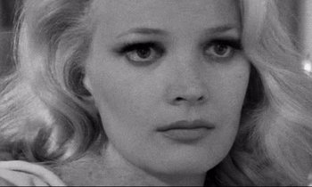Movie still from “Faces” (1968), directed by John Cassavetes – A black and white photo of a woman's face; Close Up shot, Over the shoulder angle