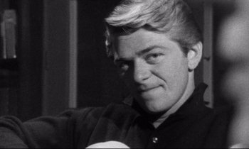 Movie still from “Faces” (1968), directed by John Cassavetes – Black and white photograph of a man with blonde hair; Close Up shot, Low angle