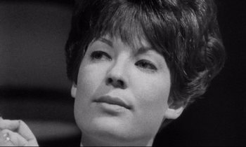 Movie still from “Faces” (1968), directed by John Cassavetes – A person with short brown hair; Close Up shot, Low angle