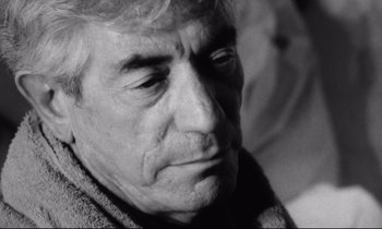 Movie still from “Faces” (1968), directed by John Cassavetes – An older man is looking down at his face; Close Up shot, Over the shoulder angle