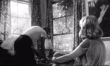 Movie still from “Faces” (1968), directed by John Cassavetes – Two women are sitting in front of a window; Medium shot, Low angle