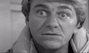 Movie still from “Faces” (1968), directed by John Cassavetes – A man's face in black - and - white photo; Extreme Close Up shot, Low angle