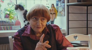 Movie still from “Faces Places” (2017), directed by Agnès Varda – An older woman is sitting at a table; Medium shot, Over the shoulder angle