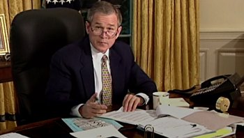 Movie still from “Fahrenheit 9/11” (2004), directed by Michael Moore – President george w; Medium shot, High angle