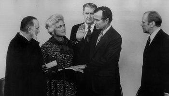 Movie still from “Fahrenheit 9/11” (2004), directed by Michael Moore – An old black and white photo of two men and a woman; Medium shot, Low angle