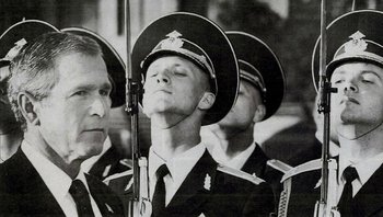 Movie still from “Fahrenheit 9/11” (2004), directed by Michael Moore – A black - and - white photo of three men in uniform; Close Up shot, Low angle