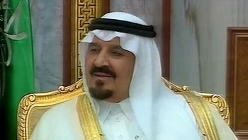 Movie still from “Fahrenheit 9/11” (2004), directed by Michael Moore – A person wearing a headdress; Close Up shot, Low angle