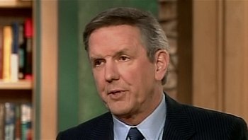 Movie still from “Fahrenheit 9/11” (2004), directed by Michael Moore – A person wearing a suit and tie; Close Up shot, Low angle