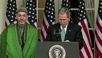 Movie still from “Fahrenheit 9/11” (2004), directed by Michael Moore – President george w; Medium shot, Over the shoulder angle