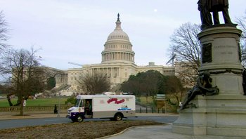 Movie still from “Fahrenheit 9/11” (2004), directed by Michael Moore – A food truck parked in front of the capitol building; Extreme Wide shot, Low angle