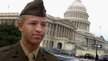 Movie still from “Fahrenheit 9/11” (2004), directed by Michael Moore – A man in a military uniform standing in front of the capitol building; Close Up shot, Low angle