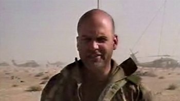 Movie still from “Fahrenheit 9/11” (2004), directed by Michael Moore – A person wearing a military uniform; Close Up shot, Low angle