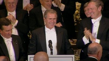 Movie still from “Fahrenheit 9/11” (2004), directed by Michael Moore – President george w; Medium shot, Low angle