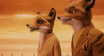 Movie still from “Fantastic Mr. Fox” (2009), directed by Wes Anderson – A couple of foxes that are standing in the sand; Close Up shot, Low angle