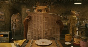 Movie still from “Fantastic Mr. Fox” (2009), directed by Wes Anderson – A person with a fox mask reading a newspaper; Close Up shot, Low angle